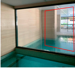 Indoor pool area with condensation on the large glass window, likely caused by high humidity levels in the heated pool